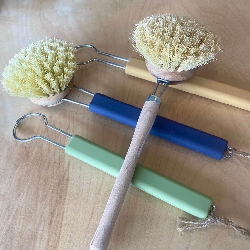 a pile of dish brush handles and brushes